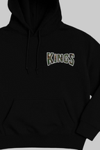 Black hoodie with 'KINGS' text on a beige background